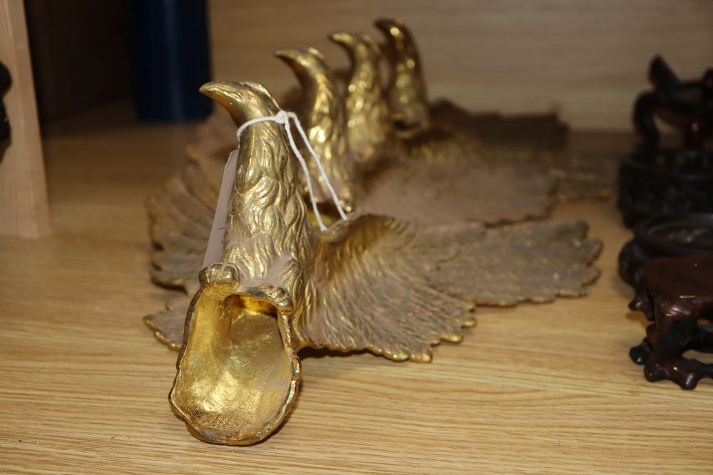 A set of four gilt metal eagle mounts, length 32cm